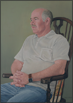 Man sitting on wooden chair